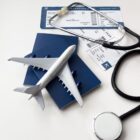 Still,Life,With,Airplane,,Stethoscope,,Passport,And,Two,Boarding,Pass.